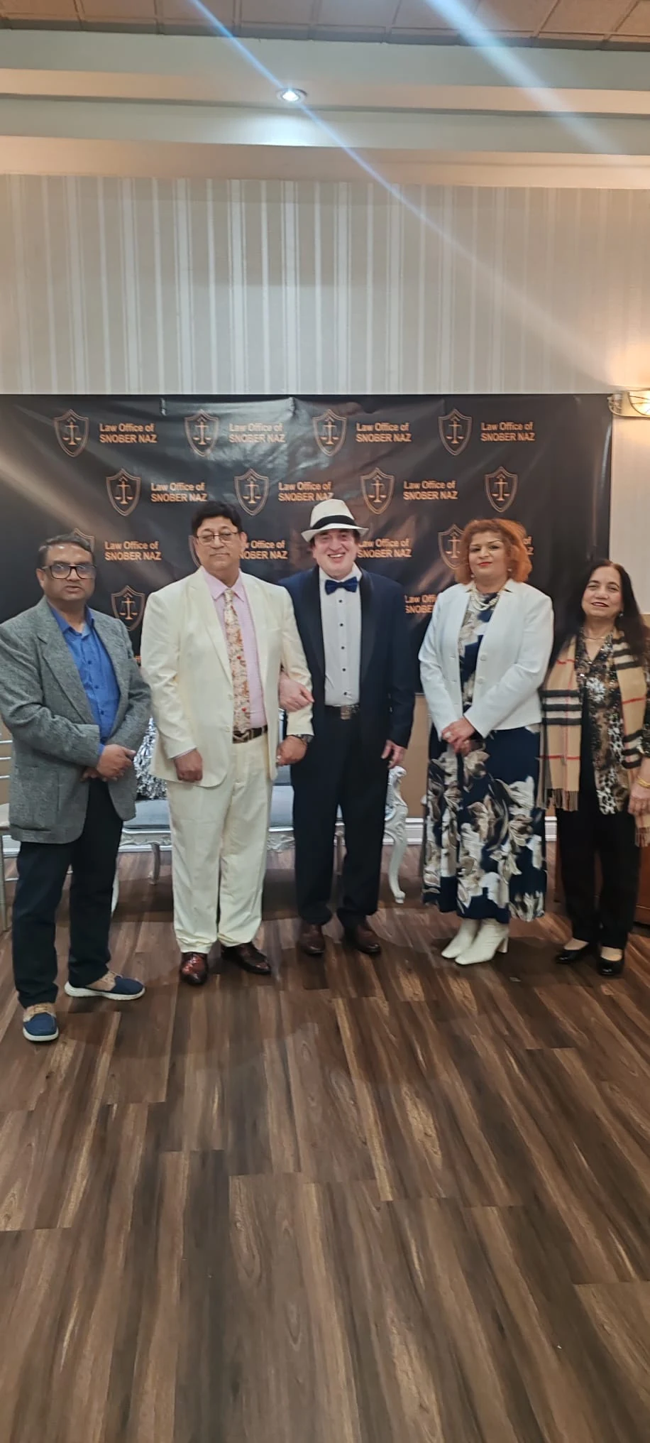 Asjad Hussain with attendees at a community event