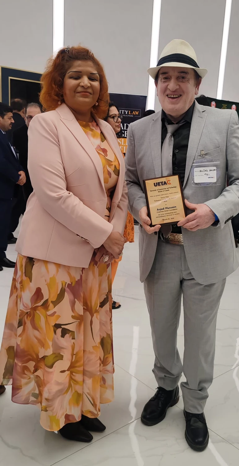 Asjad Hussain holding a 2026 volunteer service award